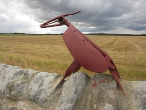 Bird sculpture on a wall